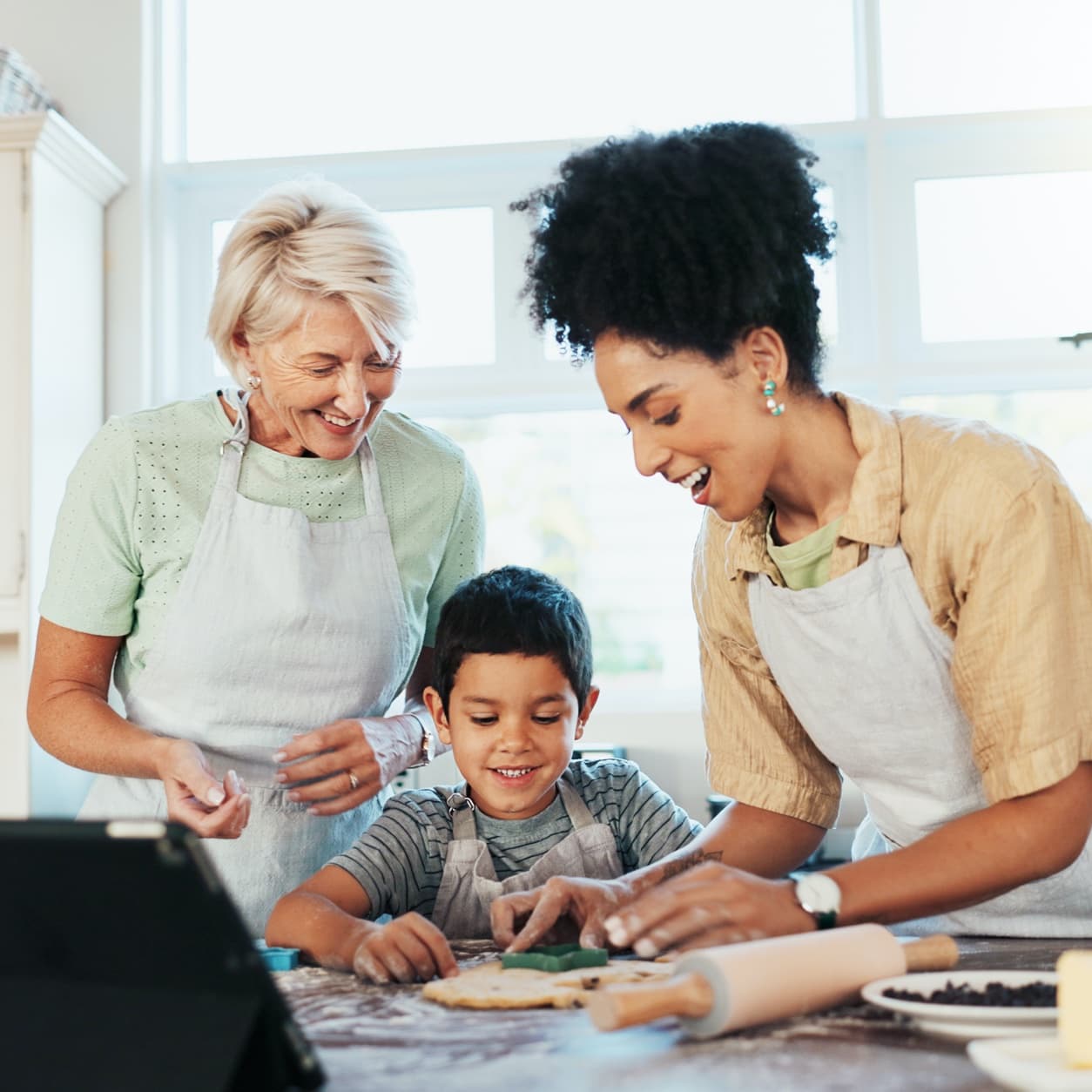 Three generations baking together at a kitchen counter